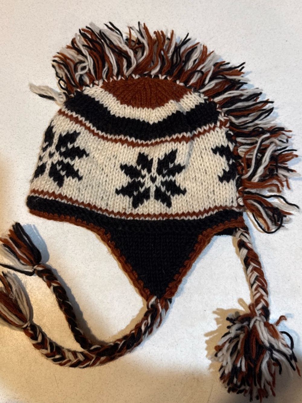 Kathmandu Kids Mohawk Earflap Knit Hat in Brown, Black & Cream